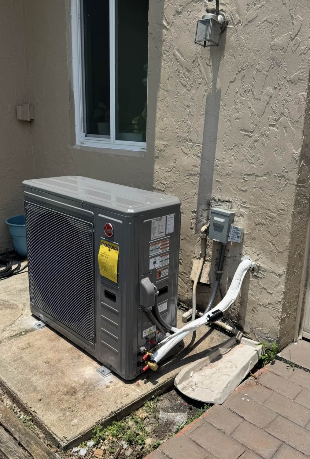 Airo technicians commissioning an AC condenser